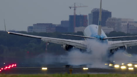 airplane landing with smoke