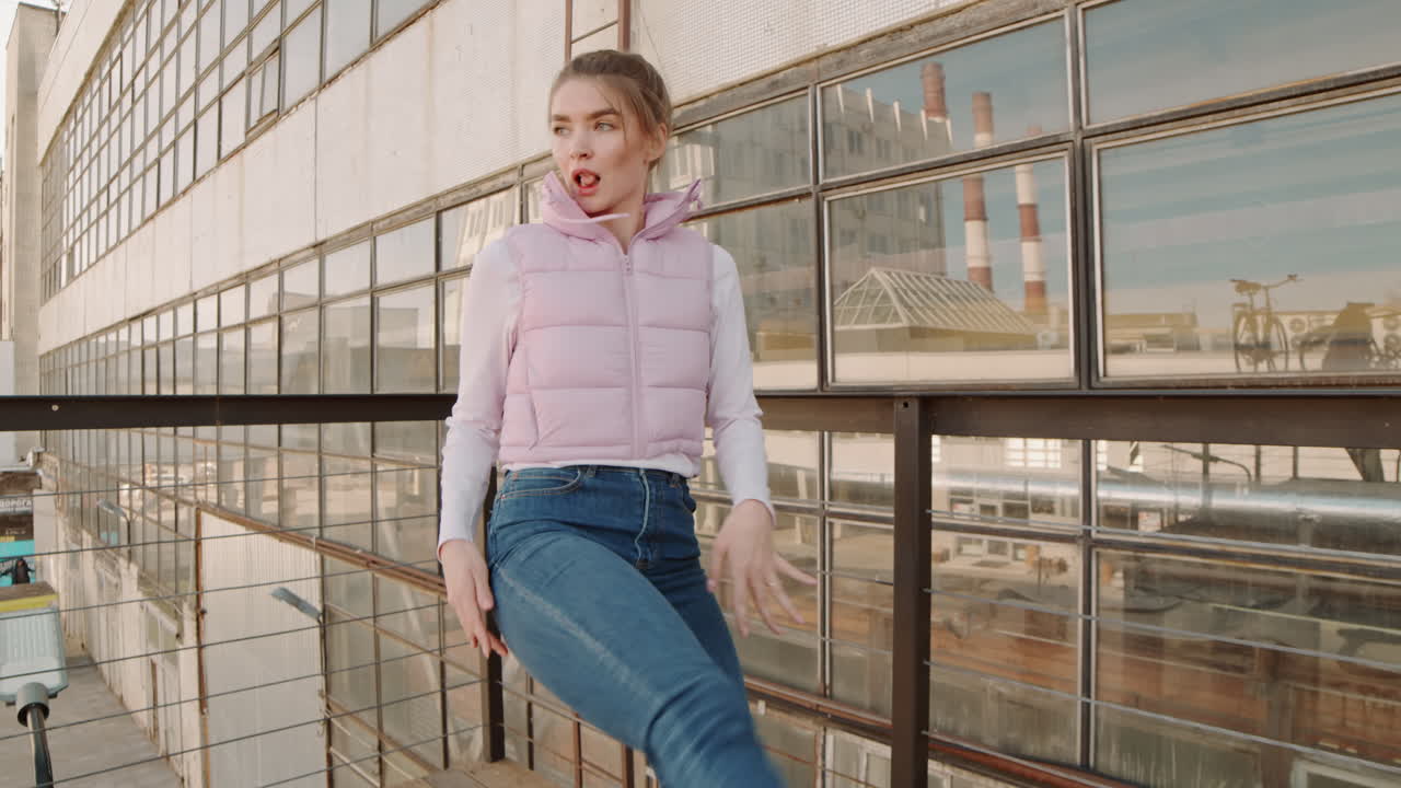Woman Dancing by Industrial Building