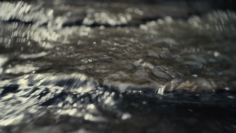 close-up of water flowing over rocks