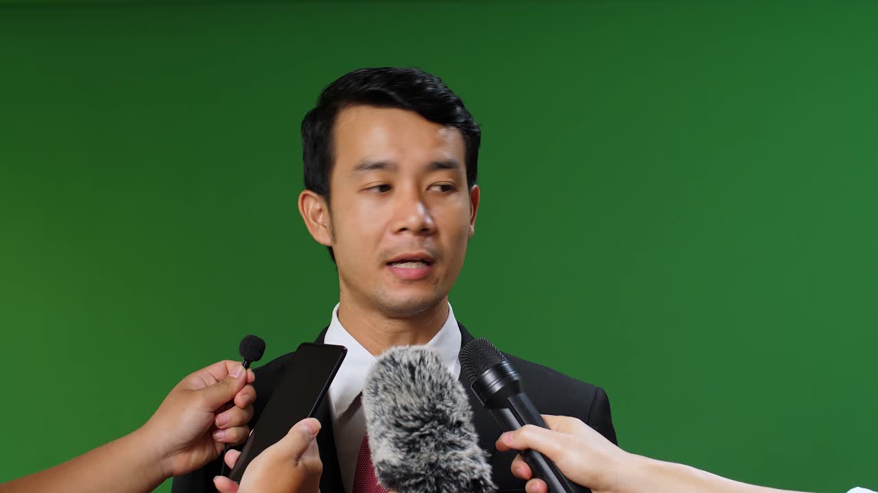 Close Up Portrait Shot Footage Of Modern Asian Male Candidate Giving Interview To Journalists, Mock Up Chroma Key Green Screen