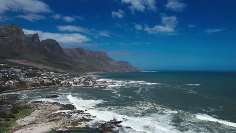 vertical drone shot of cape town, south africa from camps bay beach
