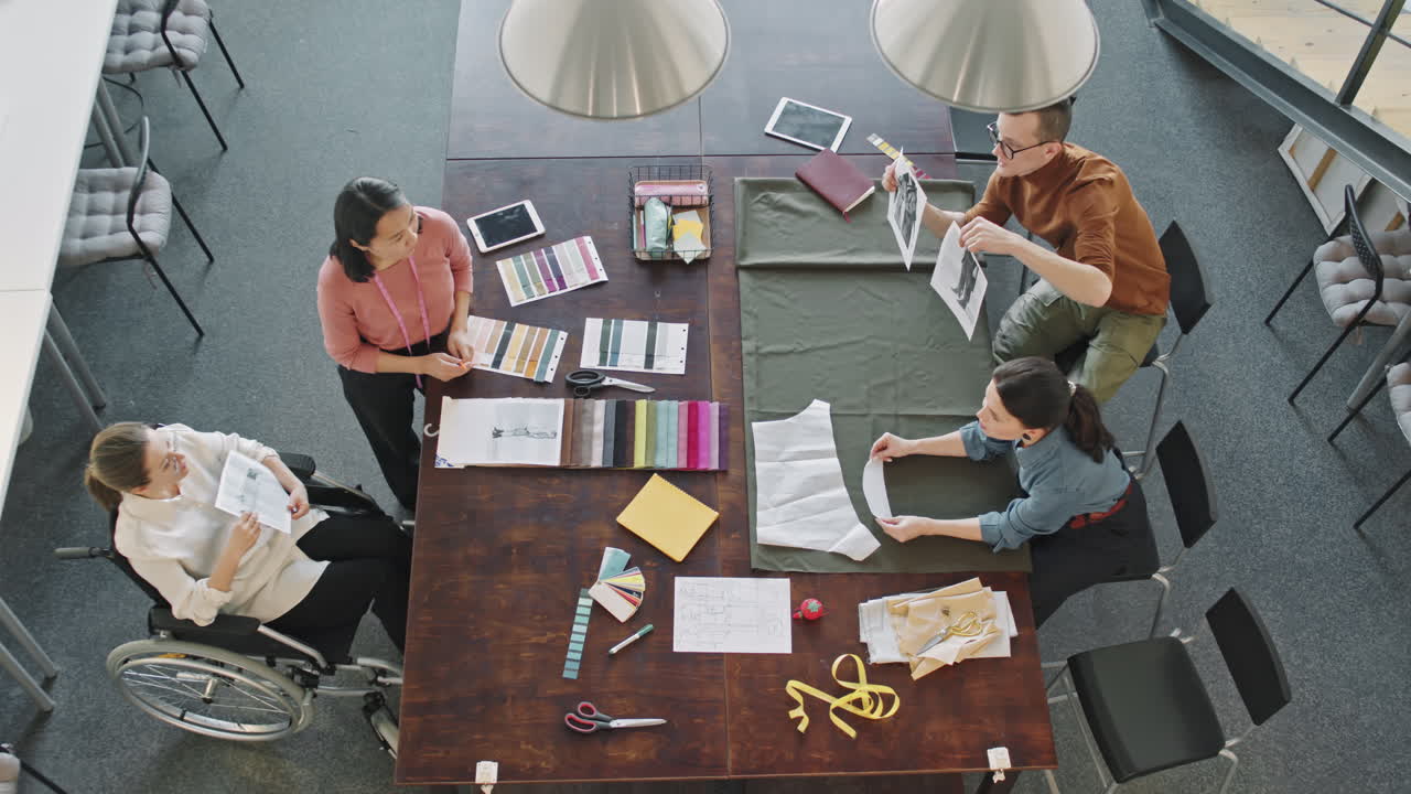 Top View of Team of Fashion Designers Working on Collection