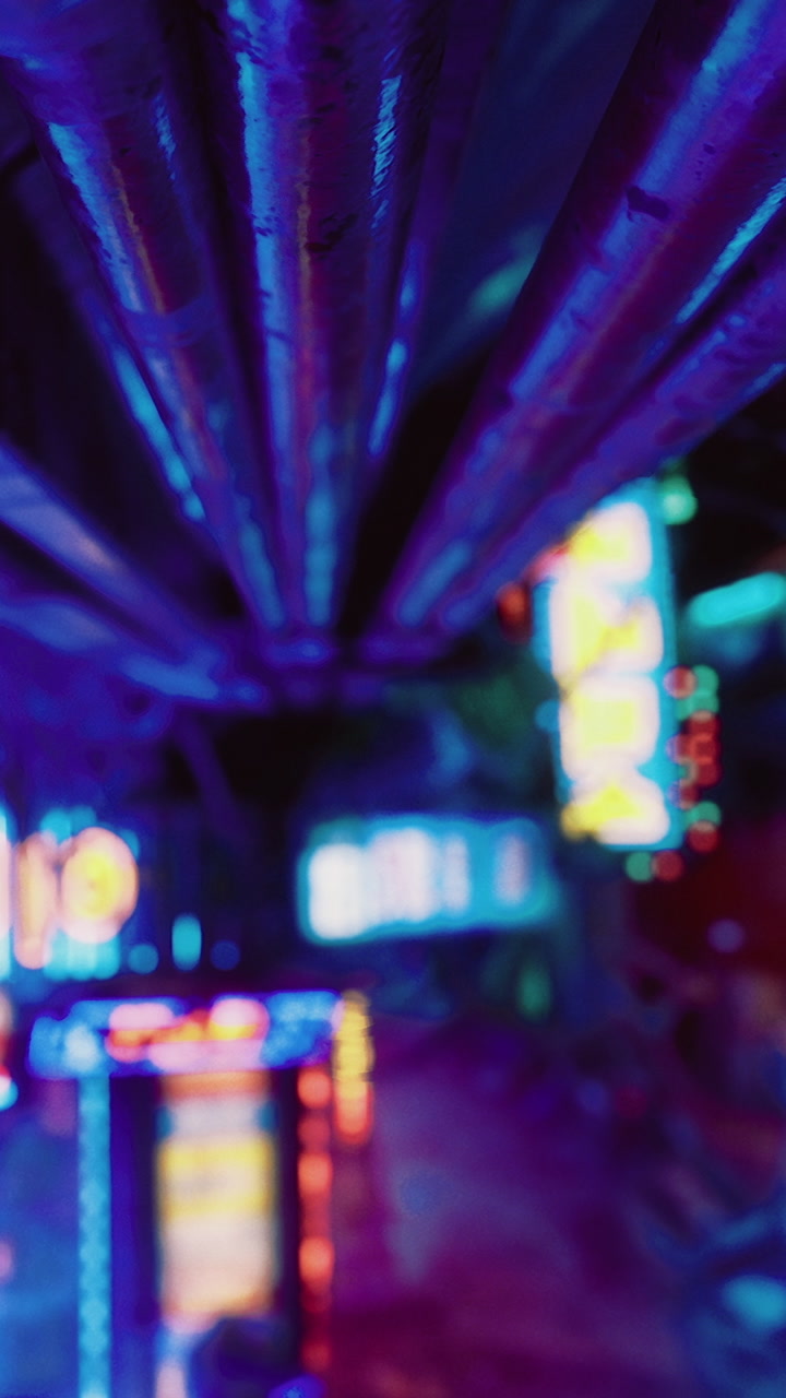 Neon lights shine through a dark alley at night in an urban setting