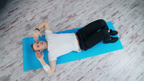 lifestyle athlete body man working out in home. handsome man training indoor.