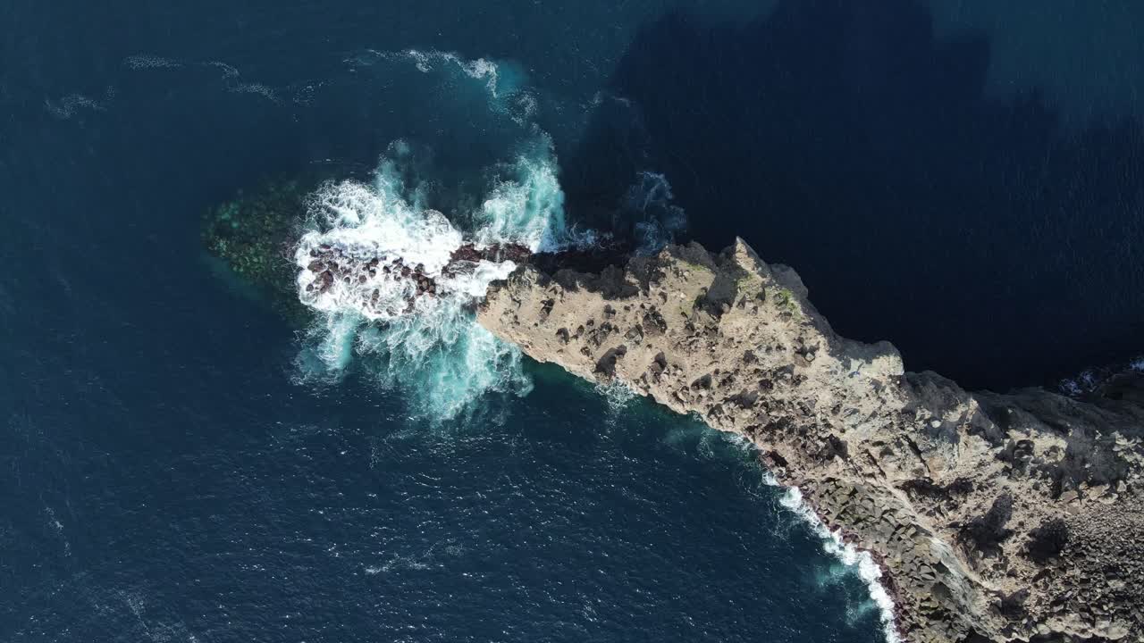 Ocean waves hitting the rocks in Azores coastline