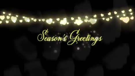 Animation-of-season's-greeting-text-over-fairy-lights-on-flickering-spots-in-background