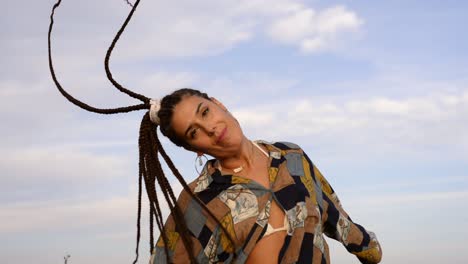 stylish woman dancing in countryside