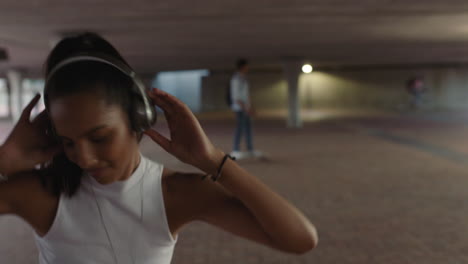 dancing woman young street dancer wearing headphones enjoying listening to hip hop music performing freestyle dance moves in city