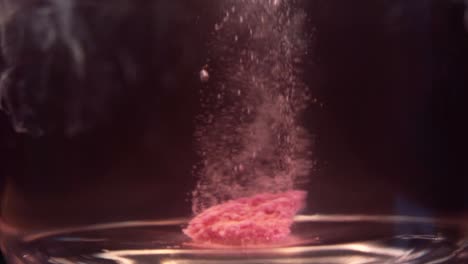 slowmotion shot of efervescent pill dissolving in water. bubbles going up. stable shot with the sony a7iii