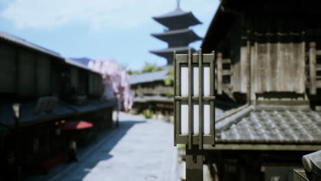 traditional japanese street with cherry blossoms and a pagoda in the background