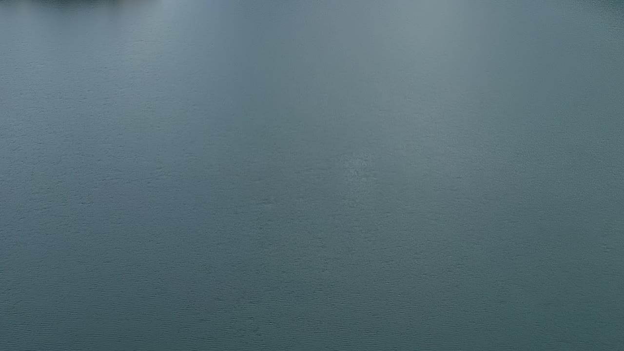 Scenic view over calm water in Granada, Spain at dusk