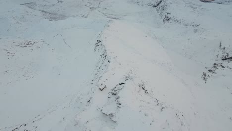 fpv drone diving down the mountainside of skittentind during sunset