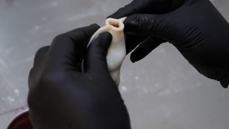 the chef shapes a strawberry pierogi using their hands