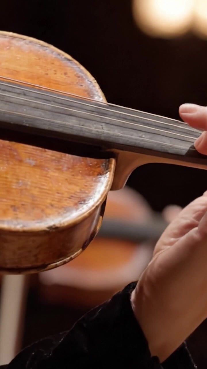 The Art of Violin Playing: A Close-Up Look at the Elegant Movements and Crafted Design of a Beautifully Aged Violin in Performance