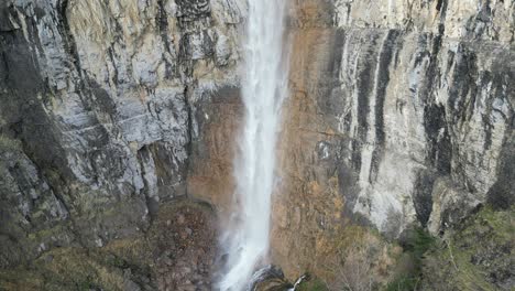 water cascade that drops sheer from the rocks