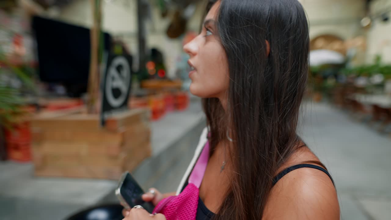 Woman in an urban outdoor cafe