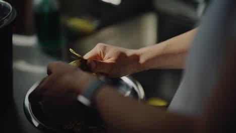peeling potatoes close up on hands