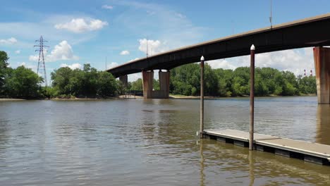 bridge spanning over a sandy river from a aerial perspective