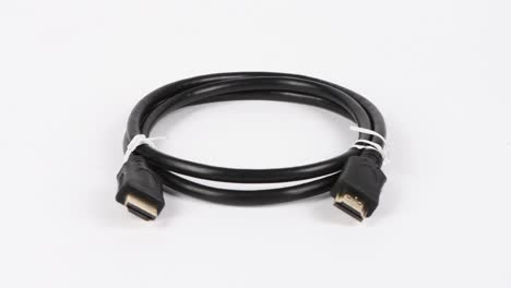 large hdmi cable on white background. side view. loop motion. rotation 360.