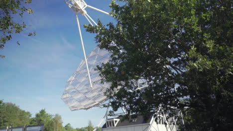 Slow-and-smooth-establishing-shot-revealing-a-gigantic-radio-telescope-used-in-astronomy