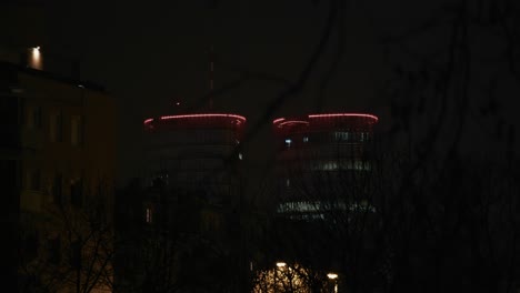 illuminated twin towers with red lights contrast the dark night sky in zagreb