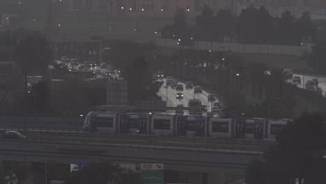 traffic on a distant highway at sunrise