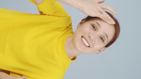 Vertical-video-of-The-woman-is-looking-at-her-skin.-He-examines-himself-in-the-mirror.