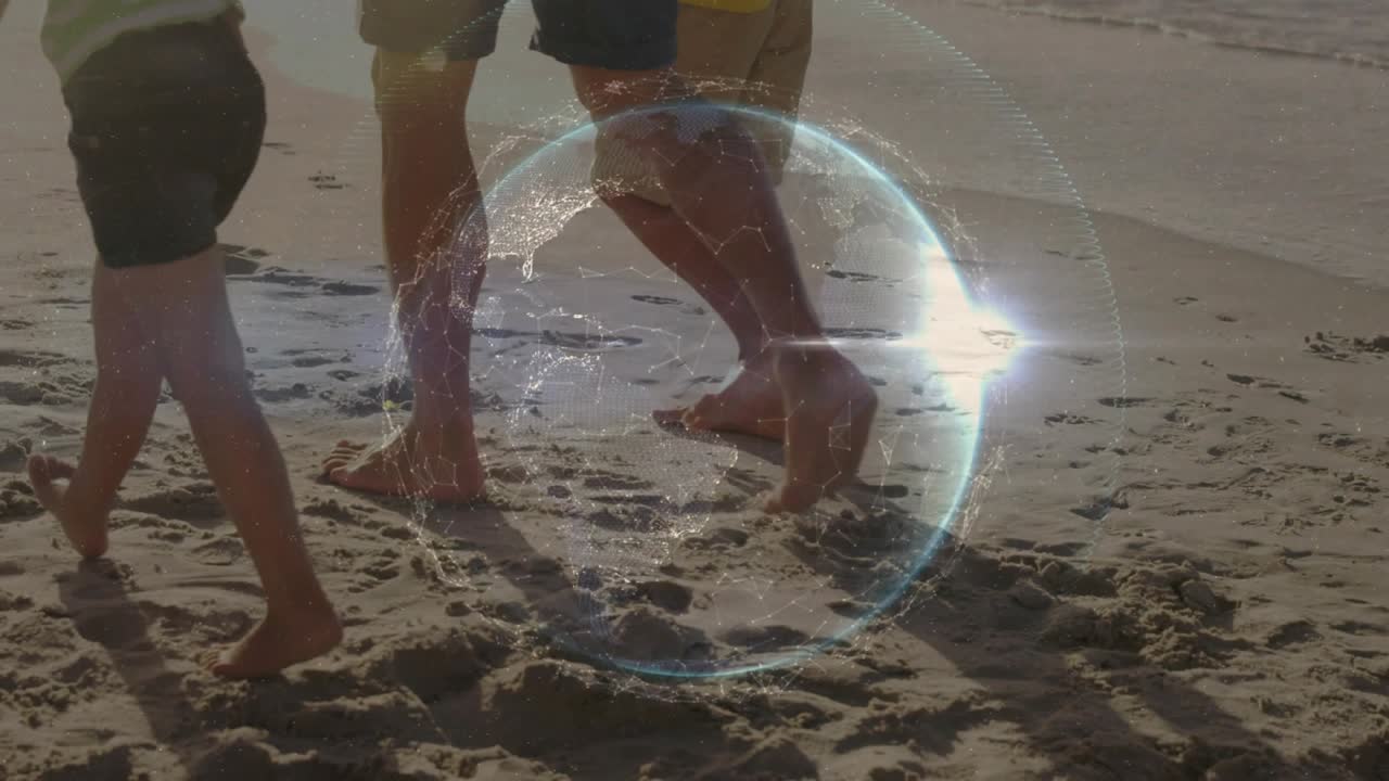 Male walking between kids along shore on stroll, leaving prints causing tech globe flare syncing