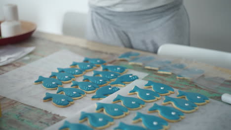 footage of a caucasian woman making whale cookies