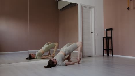 woman practicing yoga in a studio