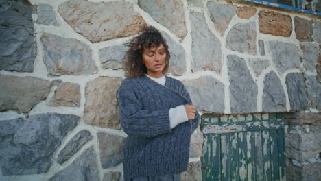 pensive model thinking alone at old building background closeup. girl pondering