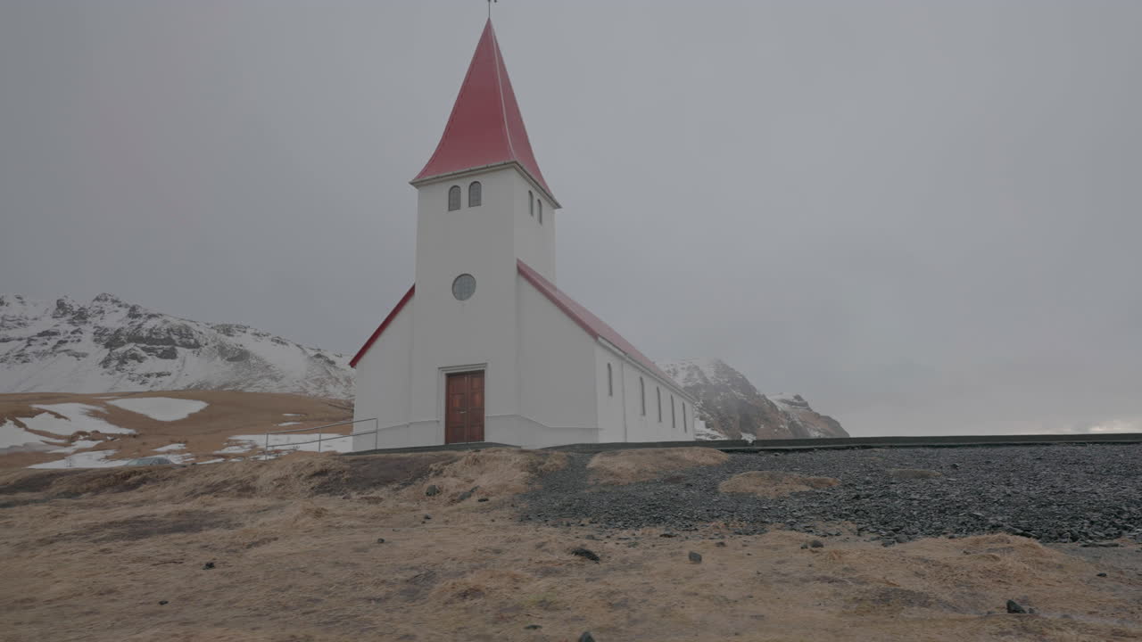 V&iacute;k i Myrdal Church, Landmark of Iceland on Cold Cloudy Spring Day, Parallax Low Angle Shot