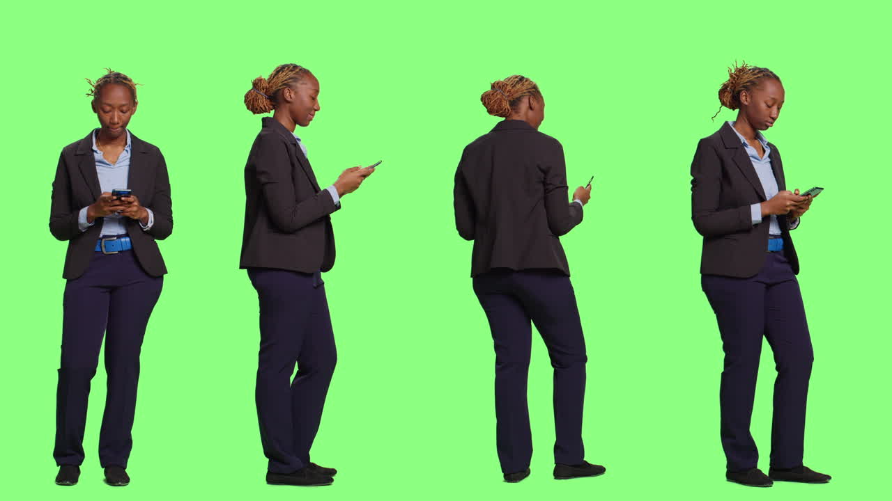 Professional Businesswoman in Suit Using Mobile Phone on Green Background