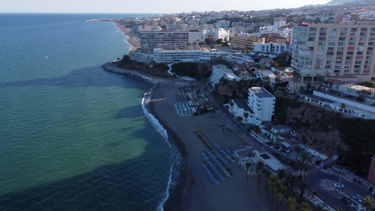 Aerial Reveal Tilt Up of Torremolinos Beach and Hotel Coastline