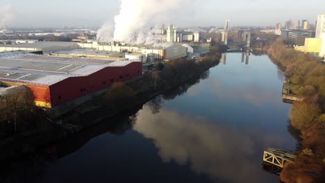 aerial static of general factories and industry over manchester ship canal with pollution