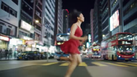 a vibrant scene capturing the essence of urban life as a woman in a striking red dress runs through bustling streets filled with illuminated signs and energetic movement.