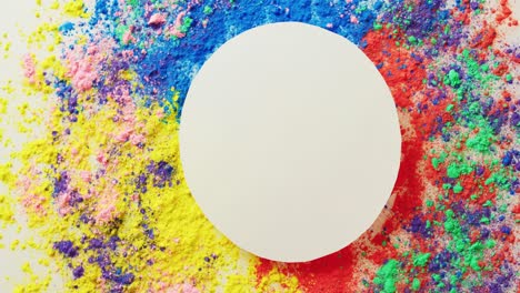 Video-of-multi-coloured-powders-and-white-circle-with-copy-space-on-white-background