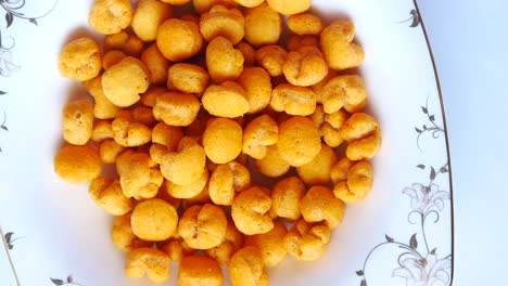 crispy orange snack balls in a bowl