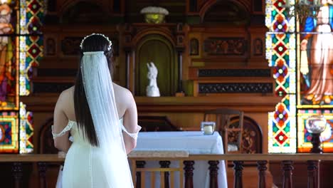 a bride, waiting for the groom in front of the altar in their wedding day