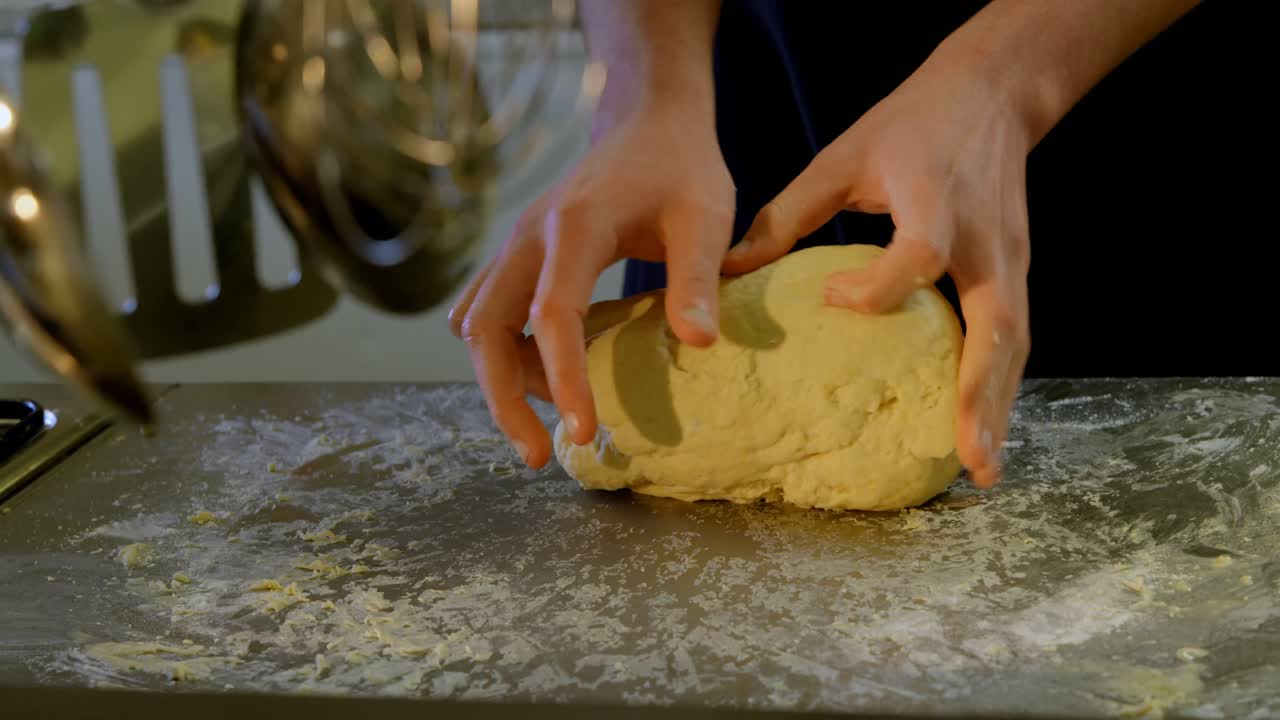 Chef kneading dough in kitchen at restaurant 4k