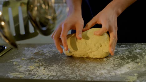 chef kneading dough in kitchen at restaurant 4k