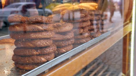 stacks of sesame turkish bagels in a bakery display