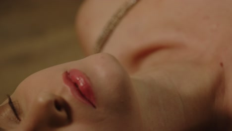 beautiful macro of an attractive woman's lip sensually moaning in pleasure