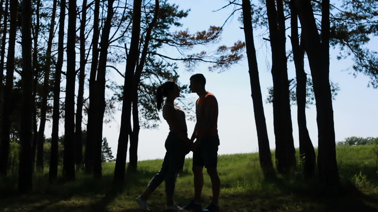 Young Couple Hugging in Love Romantic. Young couple man and woman hugging in love romantic outdoor with forest nature