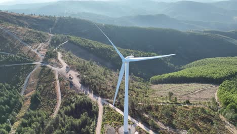 stationary scene of a slow rotating wind turbine