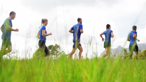 fit people jogging in boot camp 4k