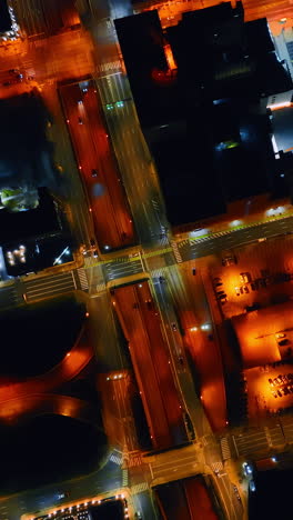 highlighted streets of philadelphia streets and roads with white and orange light. top view on the city districts at night. vertical video