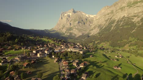 pushing-in-and-rising-down-near-Grindelwald-village-center-with-spectacular-view-of-Mount-Wetterhorn-on-a-beautiful-summer-evening