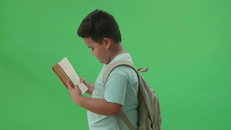 boy reading a notebook