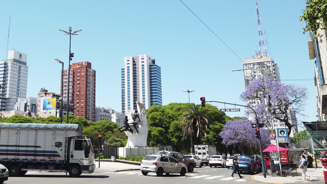 Argentine buenos aires city Panoramic Cityscape with traffic in 9 de Julio avenue and Jacaranda violet trees